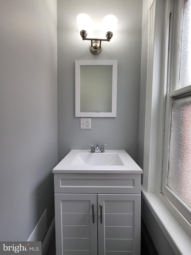 bathroom with vanity and a healthy amount of sunlight