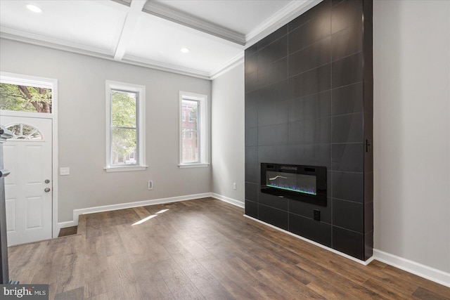 entryway featuring tile walls, coffered ceiling, hardwood / wood-style floors, and a tiled fireplace