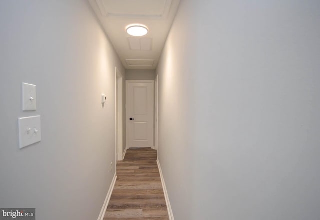 hallway with wood-type flooring