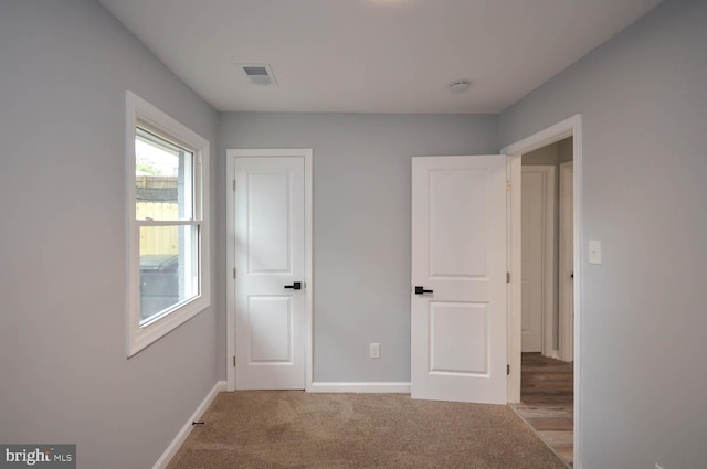 unfurnished bedroom with carpet flooring