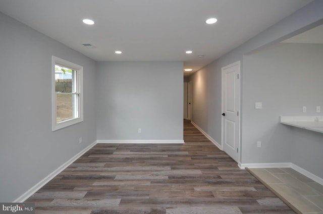 unfurnished room featuring wood-type flooring