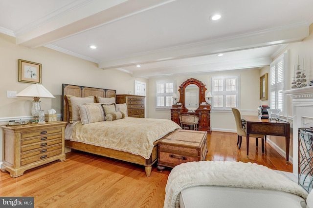 bedroom featuring beamed ceiling, multiple windows, and wood-type flooring