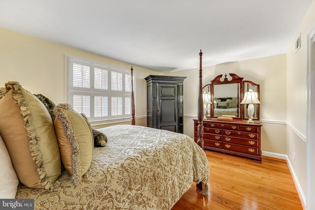 bedroom with hardwood / wood-style floors