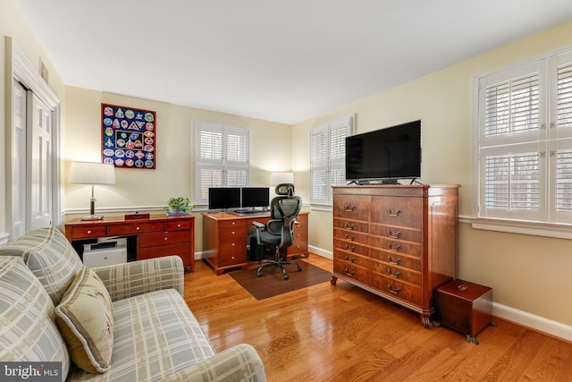 home office with light wood-type flooring