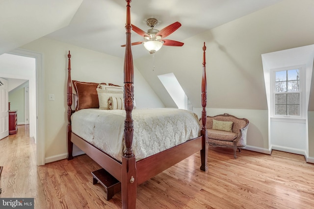 bedroom with lofted ceiling, light wood-type flooring, and ceiling fan