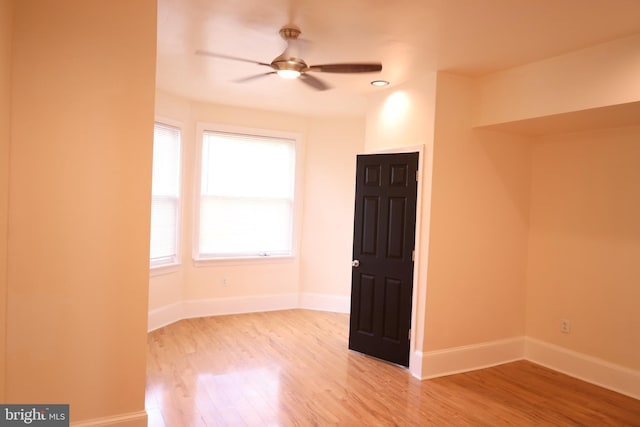 unfurnished room with ceiling fan and light hardwood / wood-style floors