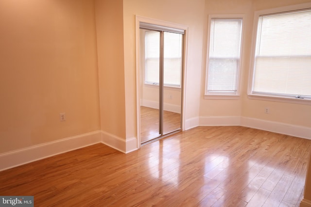 unfurnished room featuring light wood-type flooring