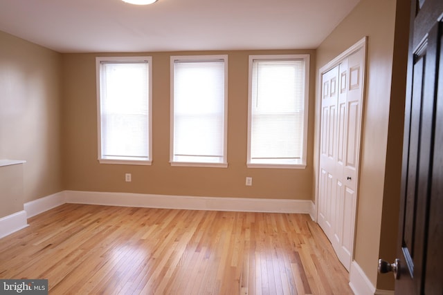 interior space featuring light hardwood / wood-style flooring and a wealth of natural light