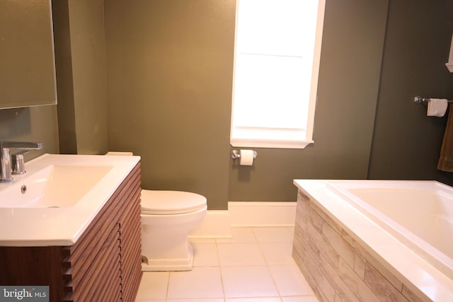 bathroom featuring vanity, tile patterned flooring, and toilet