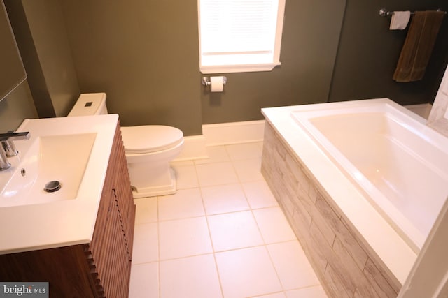 bathroom with tile patterned floors, vanity, and toilet