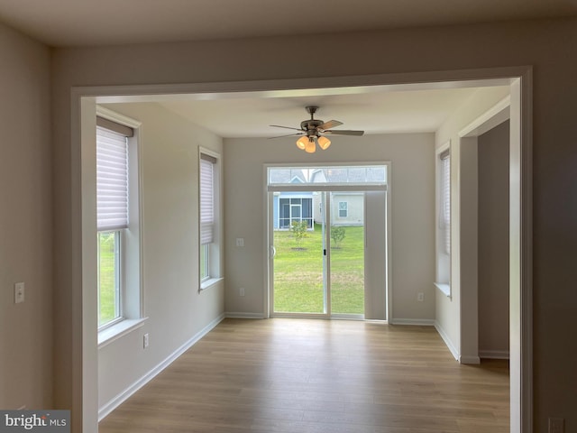 unfurnished room with ceiling fan and light hardwood / wood-style flooring