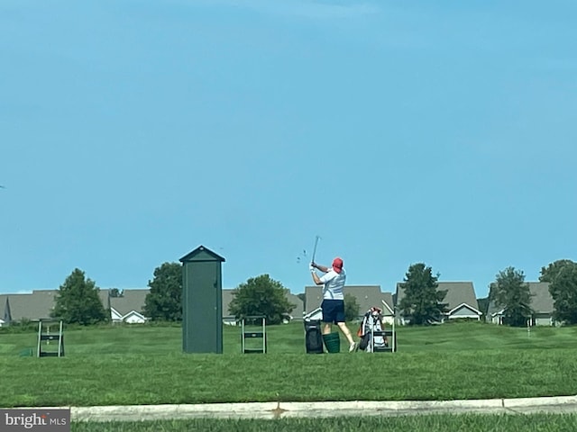 view of jungle gym featuring a lawn