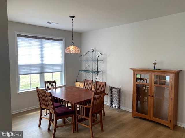 dining area featuring light hardwood / wood-style floors and a healthy amount of sunlight