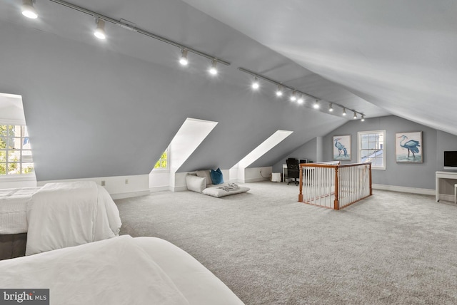 carpeted bedroom featuring vaulted ceiling