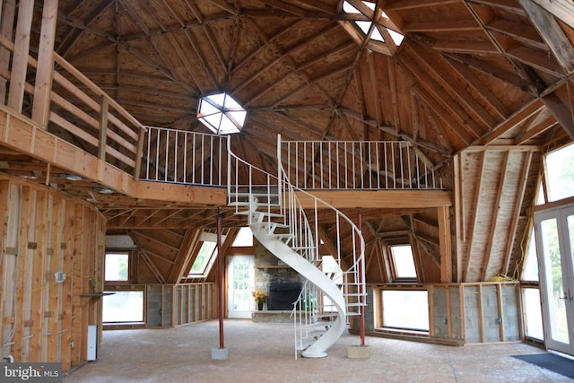 misc room with high vaulted ceiling and a wealth of natural light