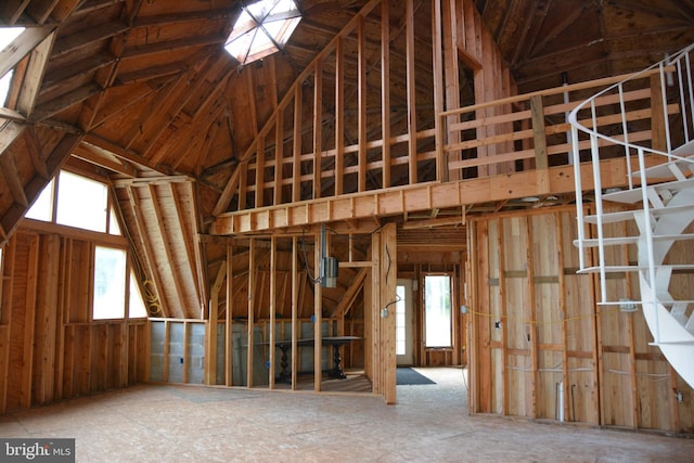 miscellaneous room featuring high vaulted ceiling