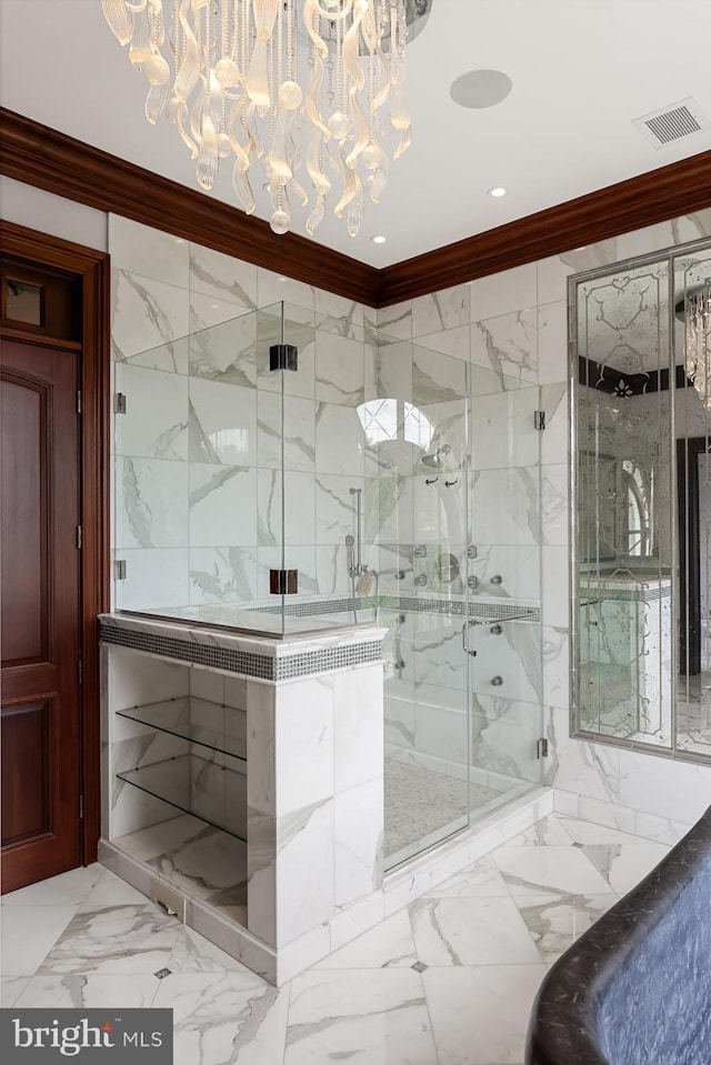 bathroom with crown molding and a shower with shower door