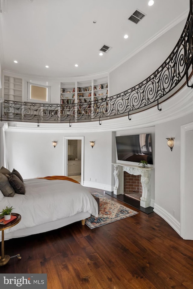 bedroom featuring crown molding and hardwood / wood-style floors