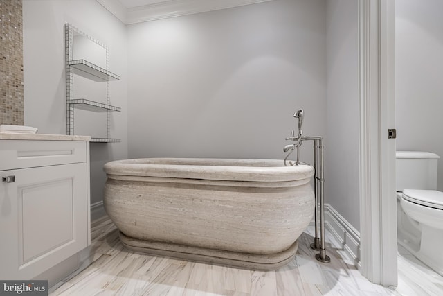 bathroom featuring ornamental molding, toilet, and vanity