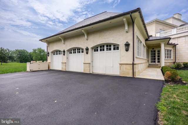 view of property exterior with a garage