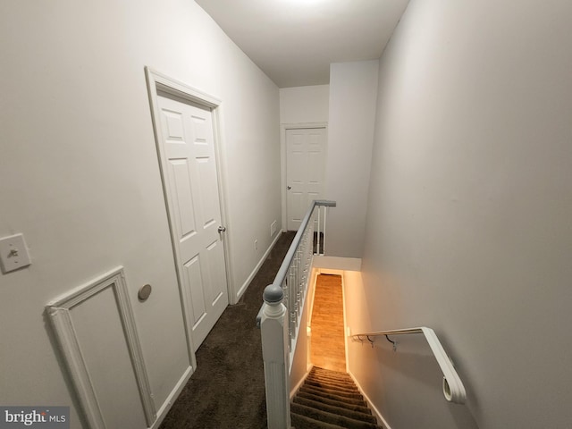 interior space featuring dark carpet