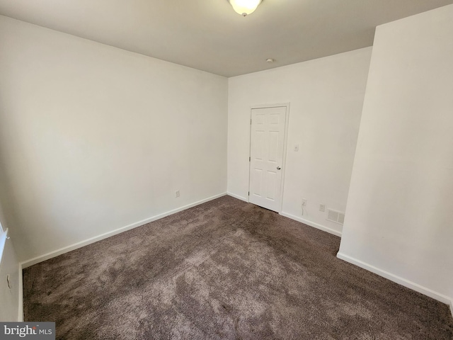 empty room featuring carpet flooring