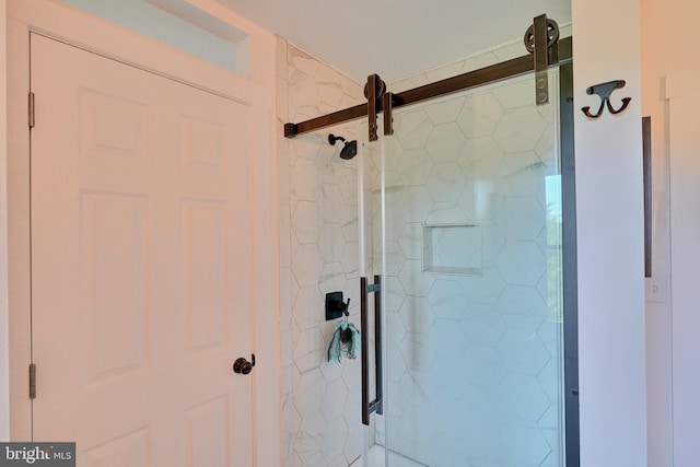 bathroom with a tile shower