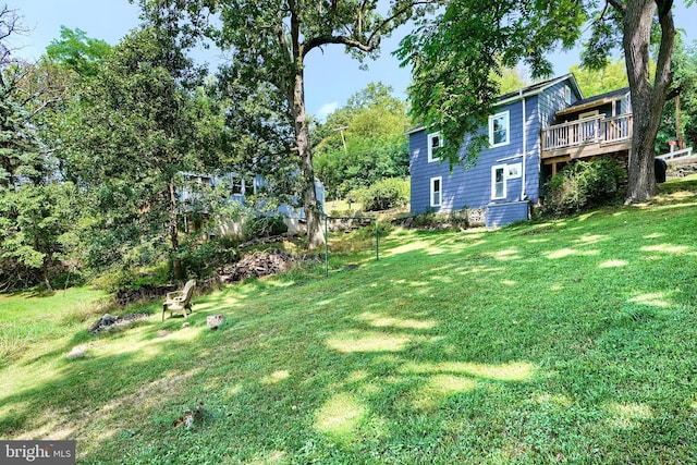 view of yard with a wooden deck