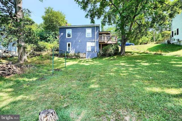 view of yard with a wooden deck