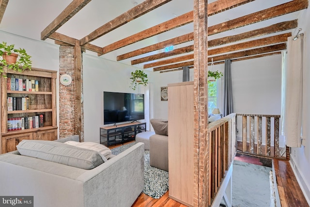 living room with beamed ceiling and hardwood / wood-style flooring