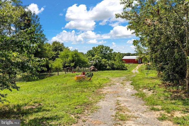 view of yard with a rural view