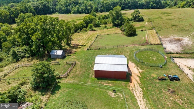 birds eye view of property featuring a rural view