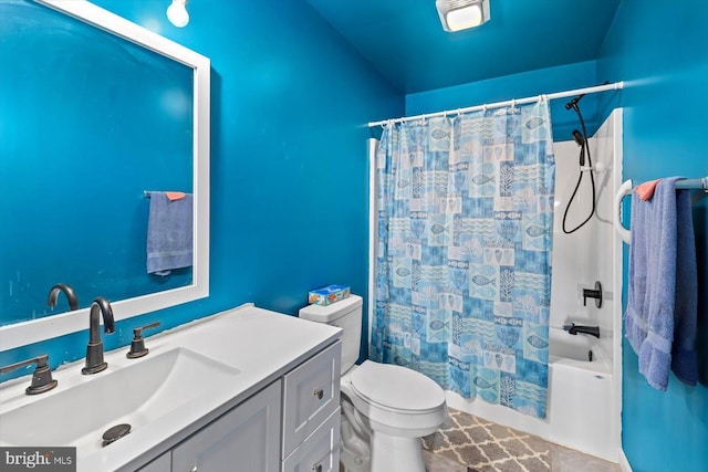 full bathroom featuring shower / tub combo, vanity, and toilet