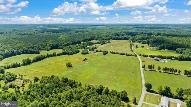 birds eye view of property with a rural view