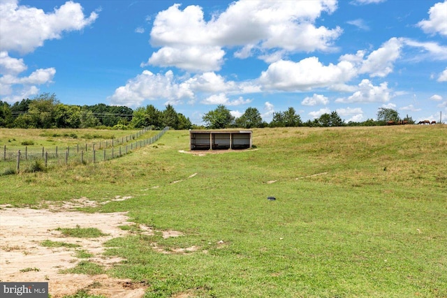 view of yard with a rural view