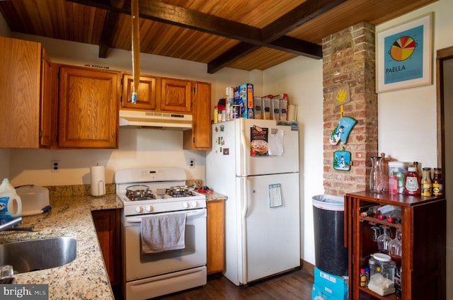 kitchen with white appliances, dark wood-type flooring, wood ceiling, beamed ceiling, and brick wall