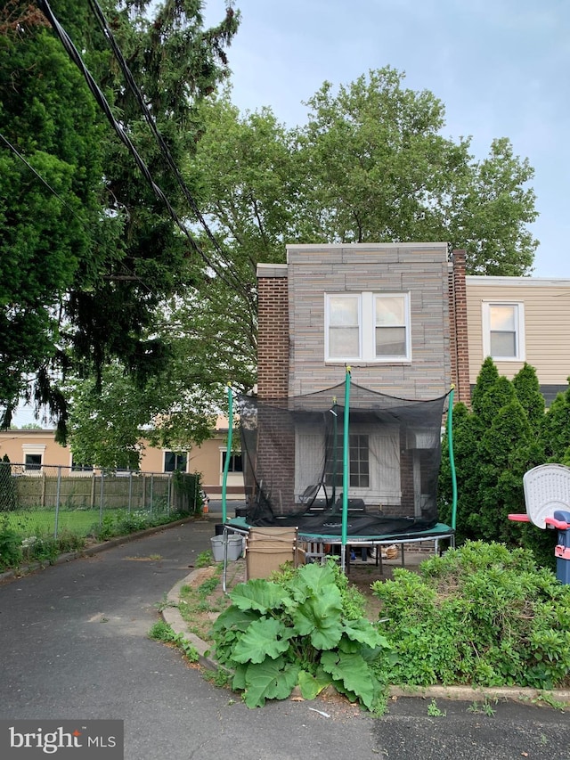 view of front of house featuring a trampoline