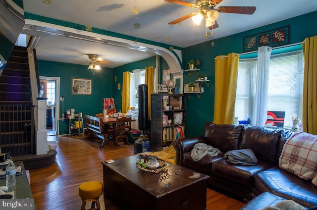 living room with hardwood / wood-style floors and ceiling fan