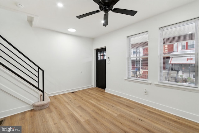 entrance foyer featuring ceiling fan and light wood-type flooring