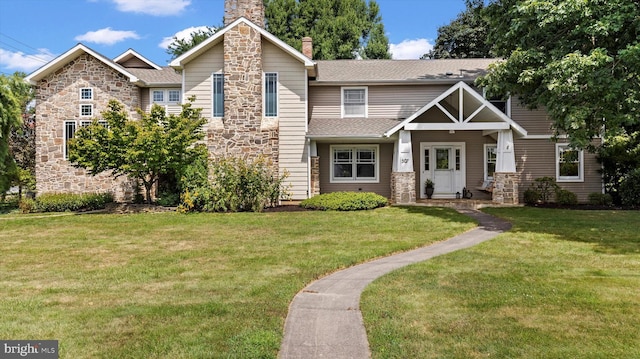 craftsman-style house featuring a front lawn