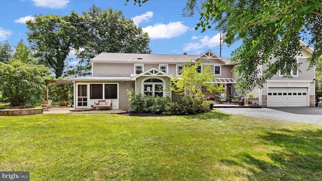 view of front of property featuring a garage and a front yard