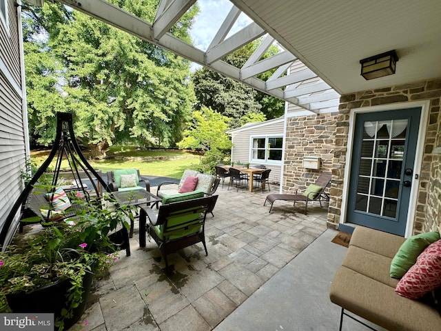 view of patio / terrace featuring an outdoor living space and a pergola