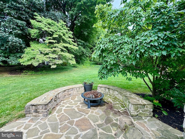 view of patio / terrace with an outdoor fire pit