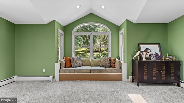 interior space with carpet, lofted ceiling, and baseboard heating