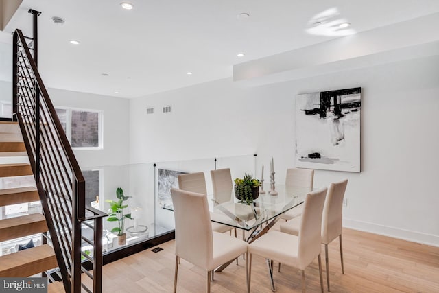 dining space with light hardwood / wood-style floors