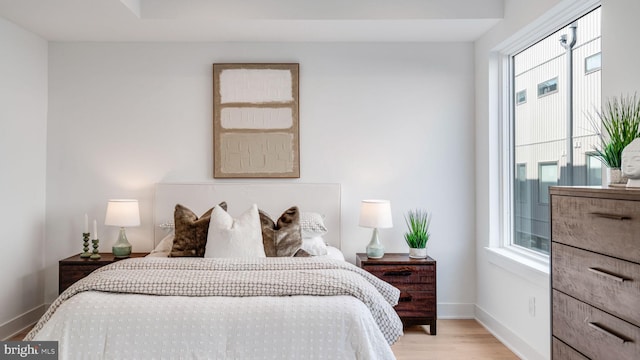 bedroom with light hardwood / wood-style flooring