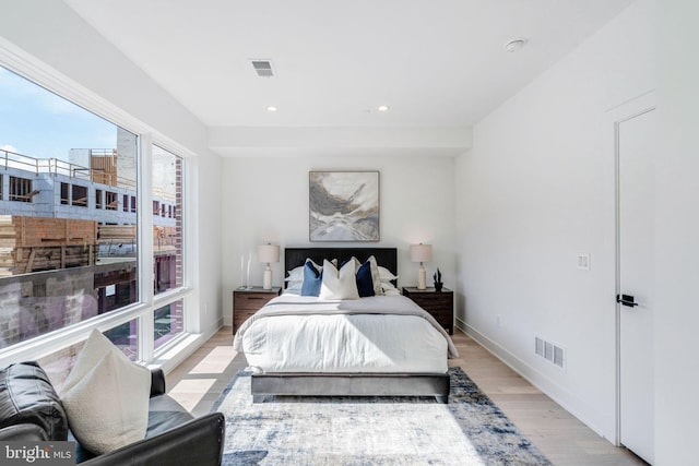 bedroom with light hardwood / wood-style floors