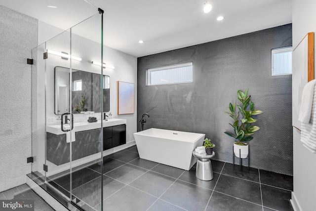 bathroom with vanity, separate shower and tub, and tile patterned flooring