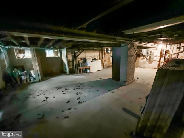 basement featuring washing machine and clothes dryer