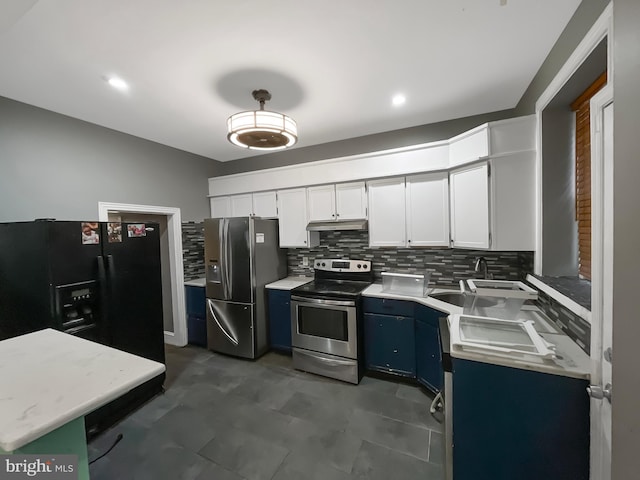 kitchen featuring blue cabinets, white cabinetry, tasteful backsplash, sink, and stainless steel appliances